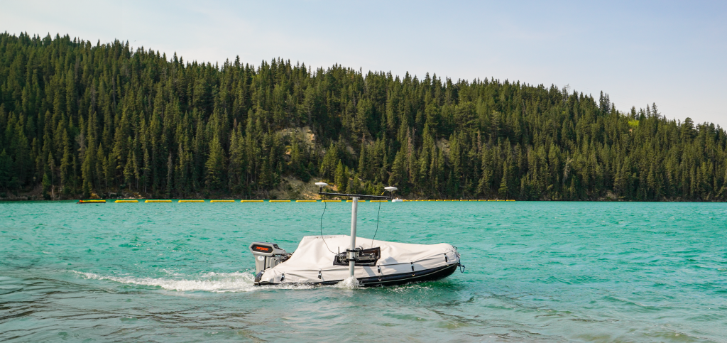 An autonomous vessel sailing in a blue lake